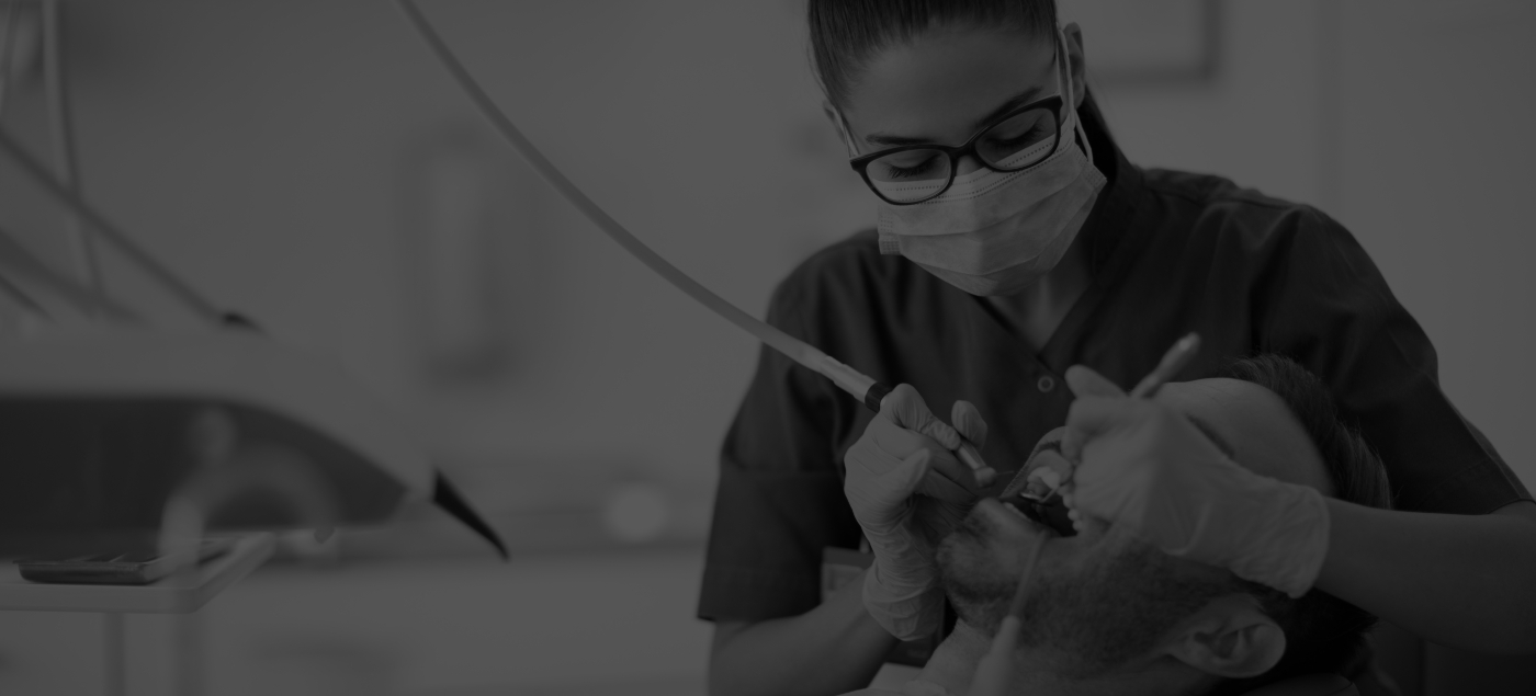 Dental hygienist performing a teeth cleaning