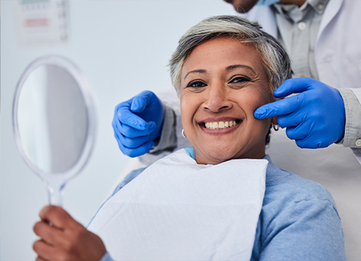 Dentist talking to a patient in the dental chair