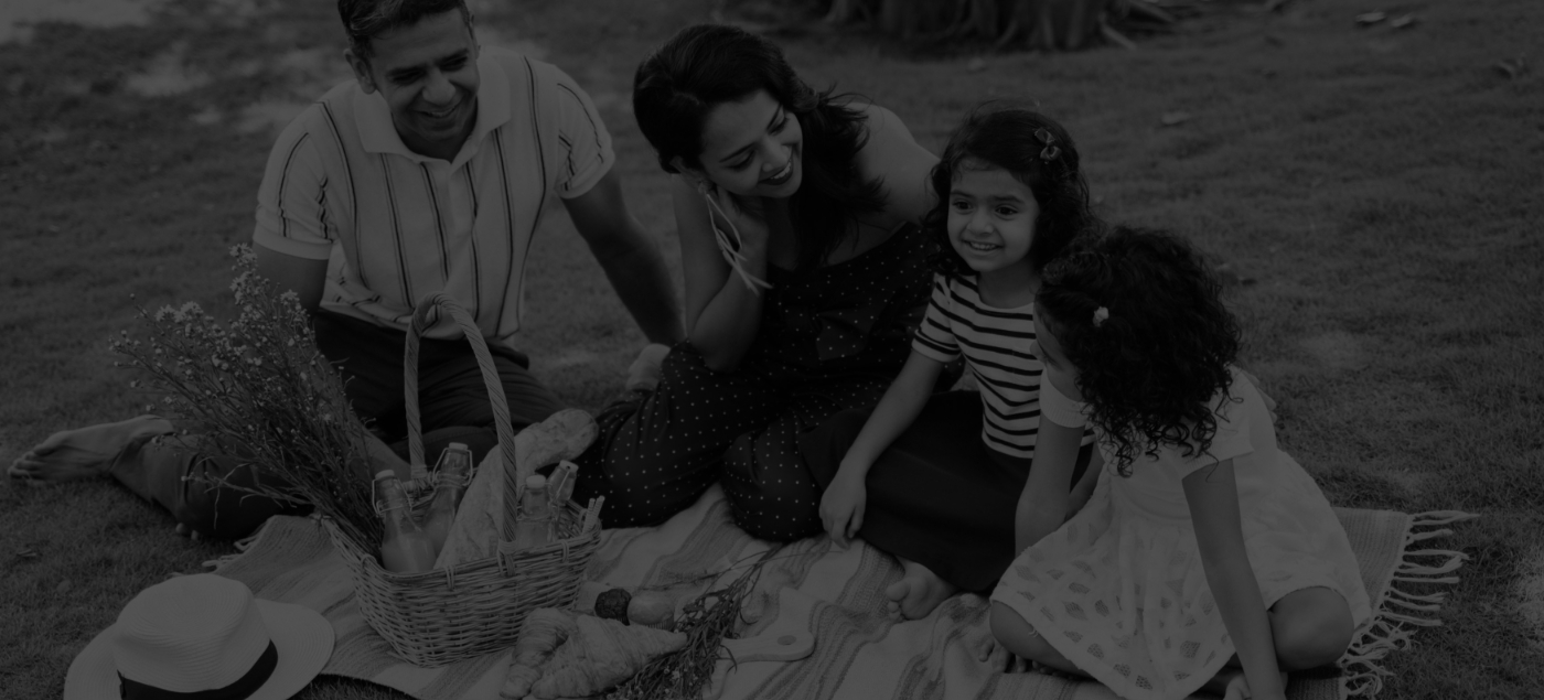 Family of four on outdoor picnic