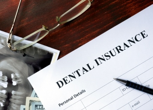 Dental insurance paperwork on table