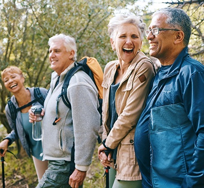Group of adults smiling together on walk